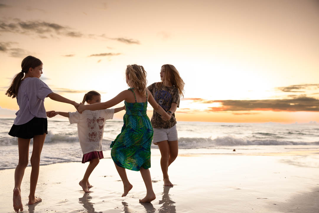 Spinning / playful moment at sunset with friends